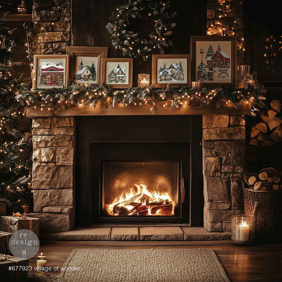 A cozy fireplace adorned with Christmas decorations features 5 wood picture frames with designs from ReDesign with Prima's Village of Wonder middy rub-on transfers.