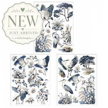 ReDesign with Prima Whispers by the Marsh rub-on transfer sheet with blue herons, marsh grasses, white flowers, and coastal botanical accents