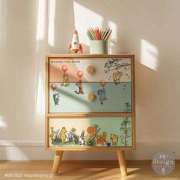 Mapleberry Glen storybook rub-on furniture transfer applied to dresser drawers for nursery and playroom decor