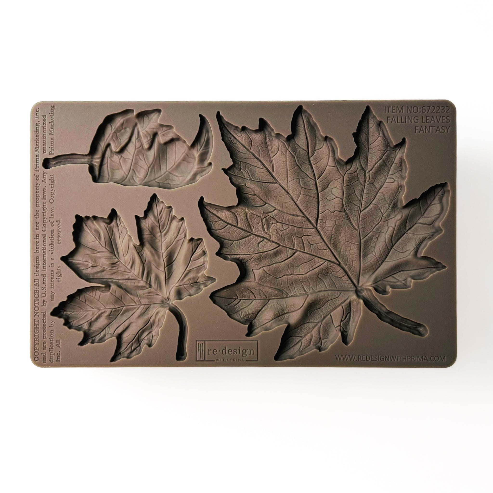 A brown silicone mold of 3 varying size maple leaves is against a white background.