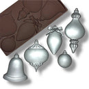 mold with Christmas ornament shapes and silver ornaments on a white background