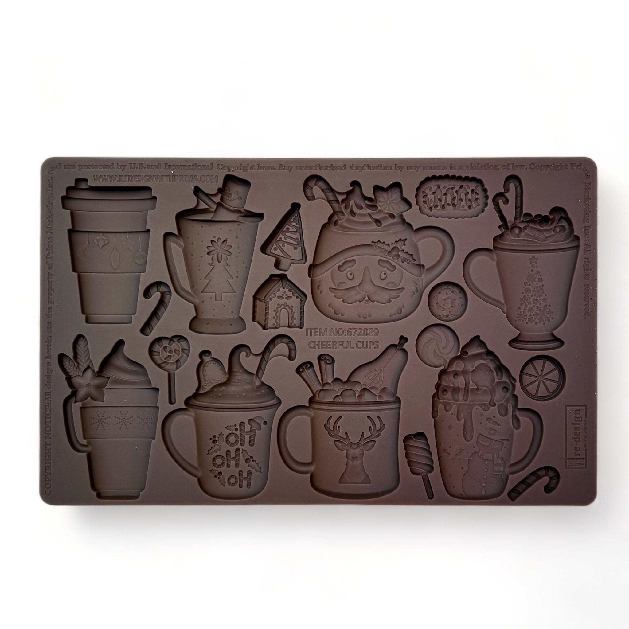 A brown silicone mold featuring 8 mugs of favorite holiday drinks and 9 adorable shapes like candy canes and gingerbread houses is against a white background.