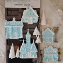 Decorative Christmas village mold set with houses and trees on a decorative background