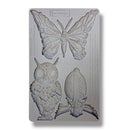 Silicone mold with butterfly, owl, and leaf shapes on a white background