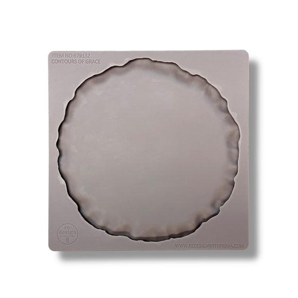 Silicone mold shaped like a pie crust on a white background