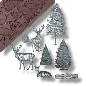 Silicone mold with forest-themed designs including deer and trees on a white background.