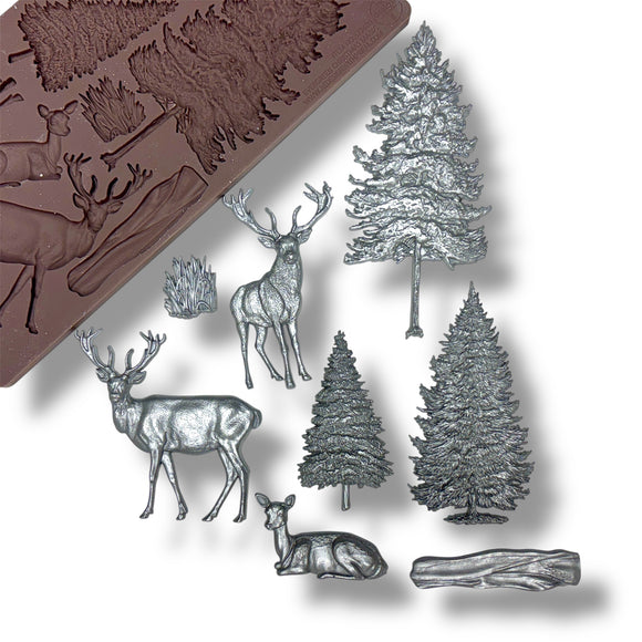 Silicone mold with forest-themed designs including deer and trees on a white background.