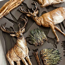 Decorative mold with deer and nature elements on a gray background