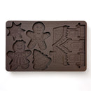 A brown silicone mold featuring gingerbread designs in the shape of a cookie man, cookie woman, Christmas tree, snowflake, and even a gingerbread house is against a white background.