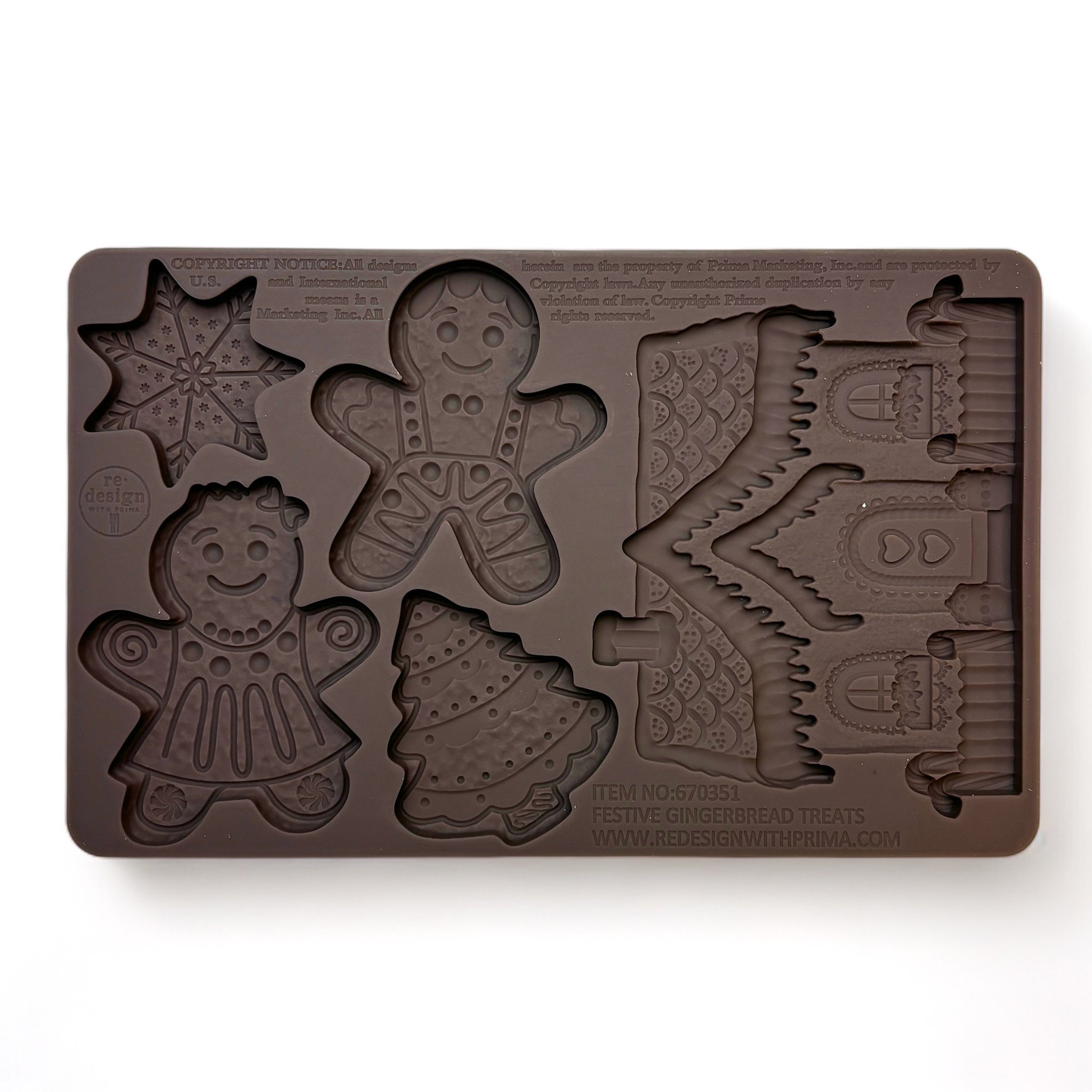 A brown silicone mold featuring gingerbread designs in the shape of a cookie man, cookie woman, Christmas tree, snowflake, and even a gingerbread house is against a white background.