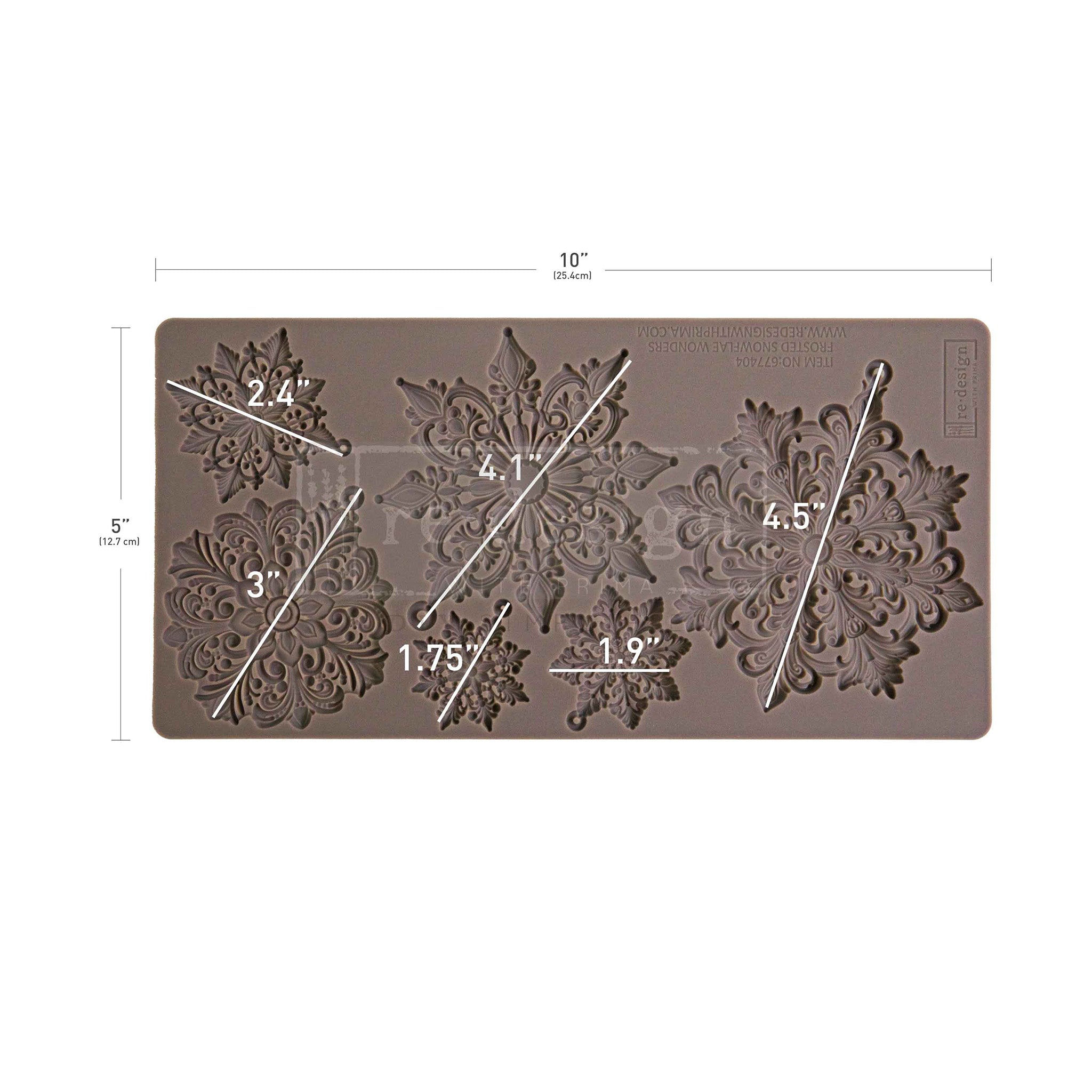 Silicone mold with snowflake designs and measurements on a white background