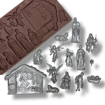 mold with nativity scene figures on a white background