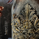 A close-up of a craft created by MC Deco Studio features ReDesign with Prima's Salon De Le Belle Epoque silicone mold casting on it with gold wax accent on it.