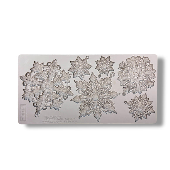 Decorative snowflake mold on a white background