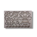 Decorative mold with bow designs on a white background