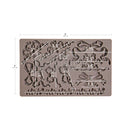 Silicone mold with floral and bow designs and measurements on a white background