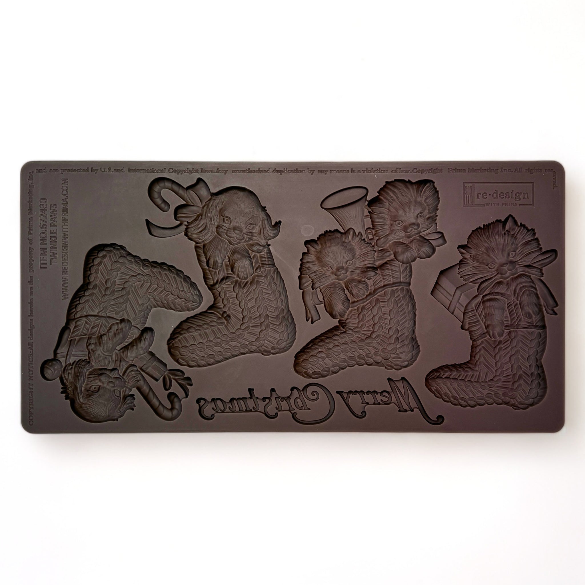 A brown silicone mold featuring 4 Christmas stockings with puppies and kittens in them and the words Merry Christmas is against a white background.