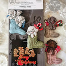 A package of ReDesign with Prima's Festive Cardinal Cheer silicone mold and colorful castings are against a white lace background.