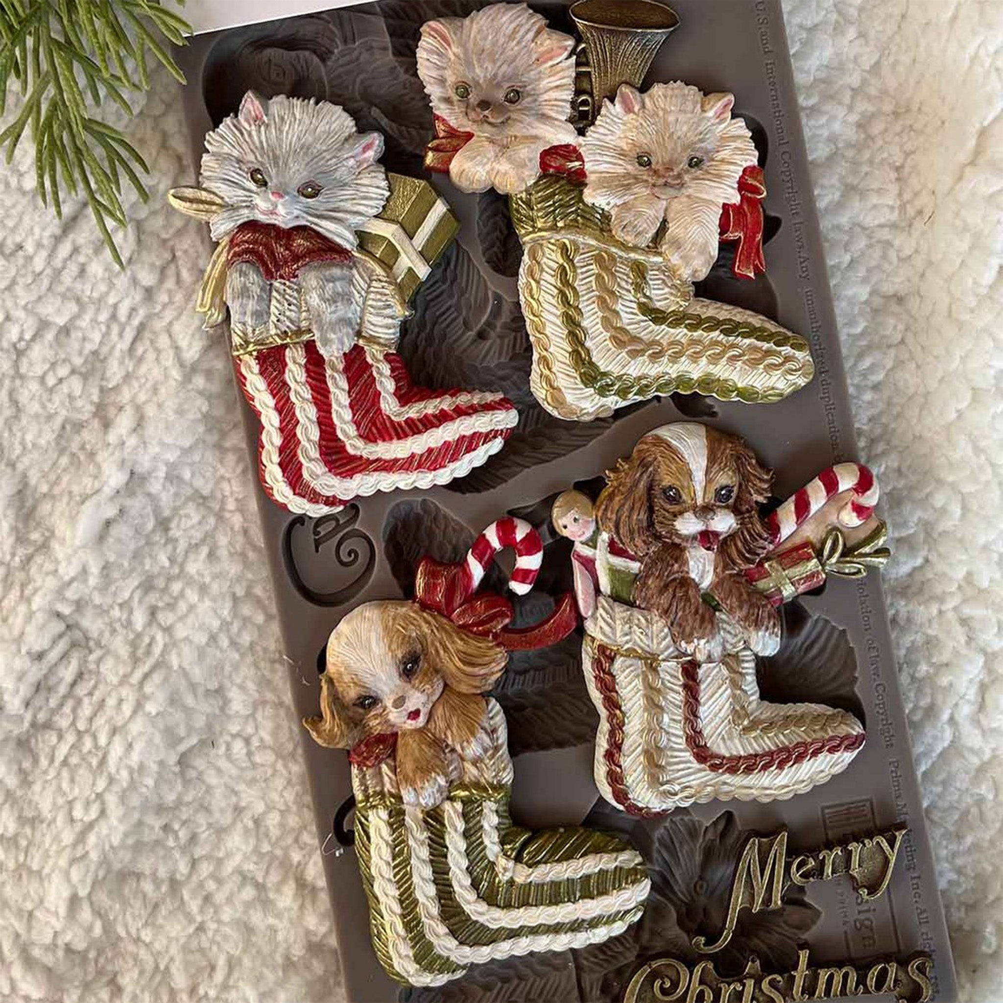 A package of ReDesign with Prima's Festive Cardinal Cheer silicone mold and colorful castings are against a white lace background.