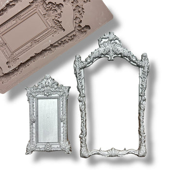 A silicone mold and silver colored castings featuring an intricate frame and smaller solid mirror-like frame are against a white background.