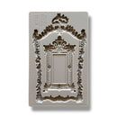 A silicone mold featuring an intricate frame and smaller solid mirror-like frame is against a white background.
