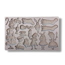 Silicone mold with various Alice in wonderland and Christmas themed decorative elements on a white background