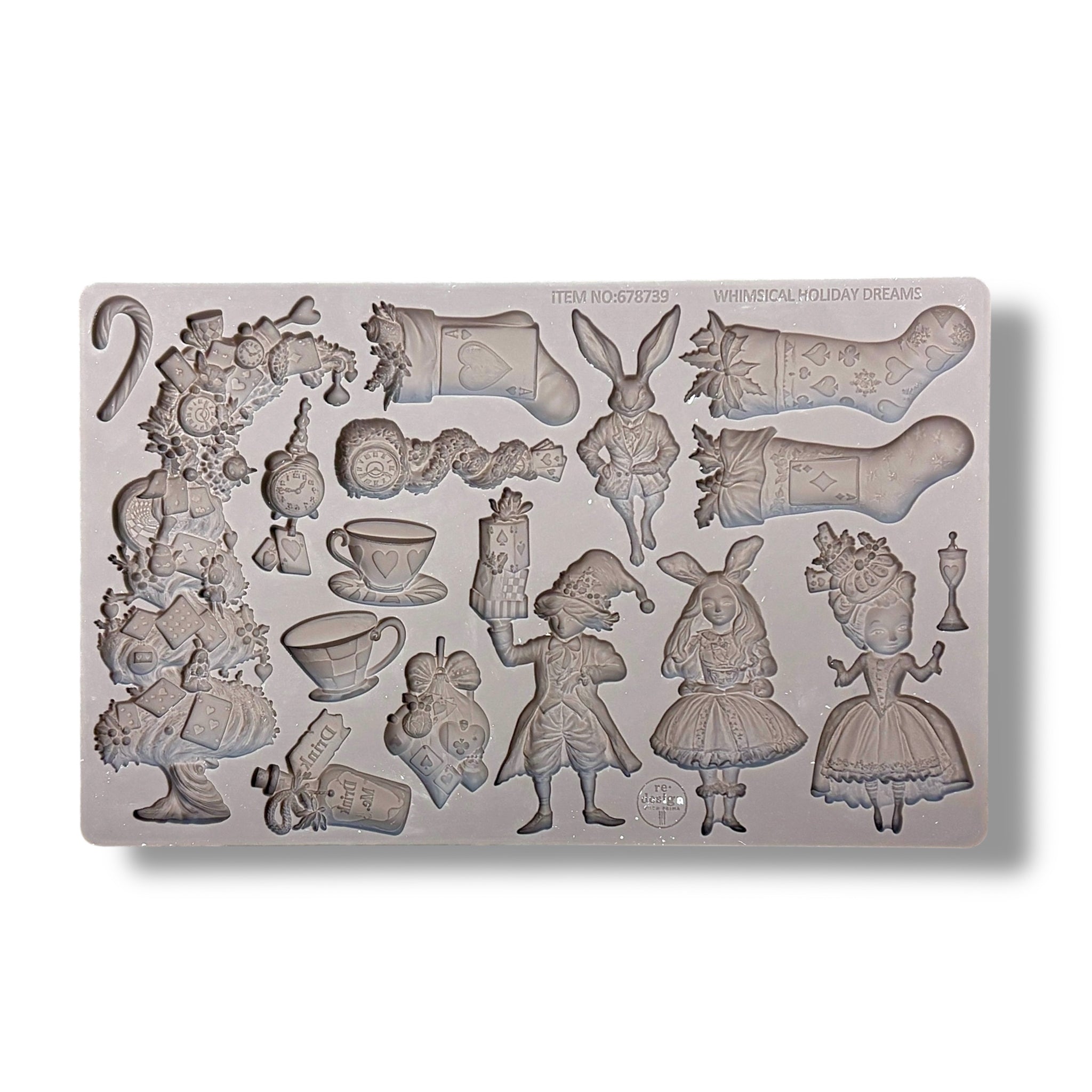 Silicone mold with various alice in wonderland and christmas themed decorative elements on a white background