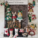 Decorative mold set with whimsical holiday designs on a white background