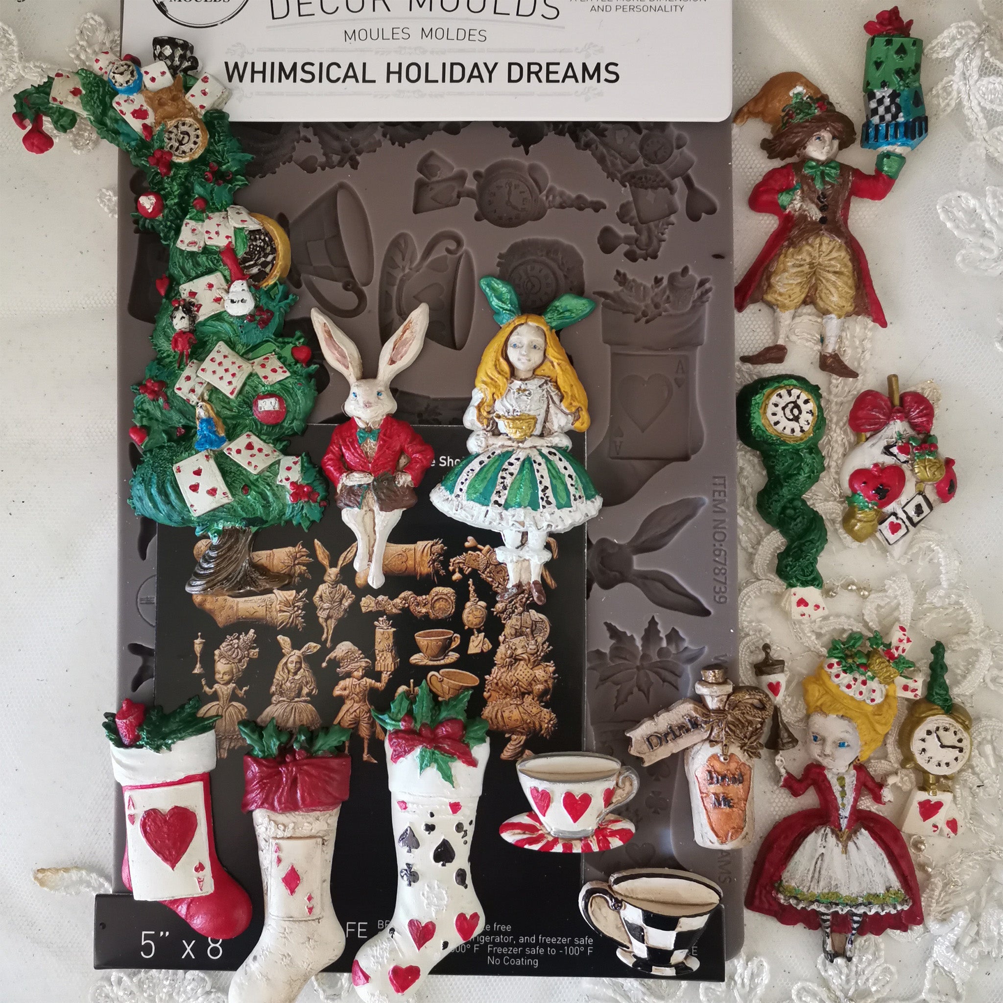 Decorative mold set with Alice in Wonderland whimsical holiday designs on a white background