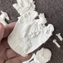 Close-up angel and lamb relief casting from Eternal Spring Faith silicone mold with detailed wings and flowers