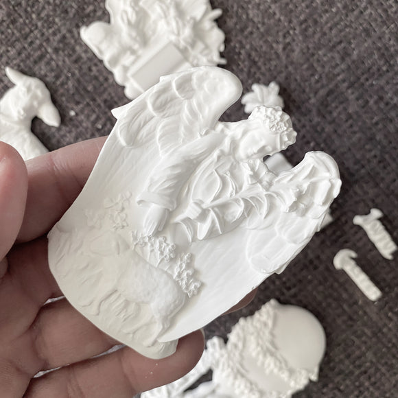 Close-up angel and lamb relief casting from Eternal Spring Faith silicone mold with detailed wings and flowers