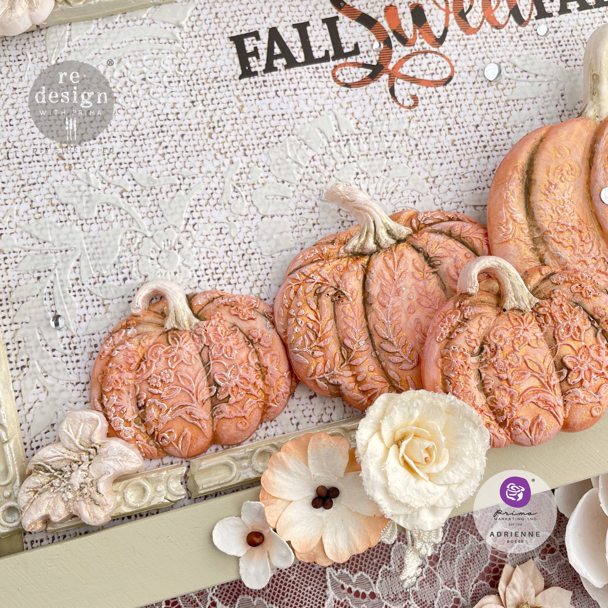 Pastel orange pumpkins on a canvas craft are created by Adrienne using ReDesign with Prima's Falling for Fall silicone mold.