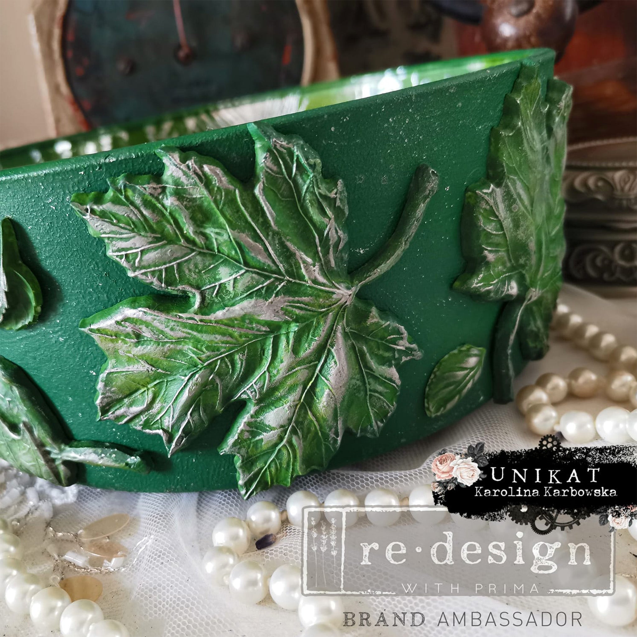 A green bowl refurbished by Unikat Karolina Karbowska features green colored leaves created from ReDesign with Prima's Falling Leaves Fantasy silicone mold.