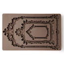 Decorative silicone mold with intricate designs on a white background.