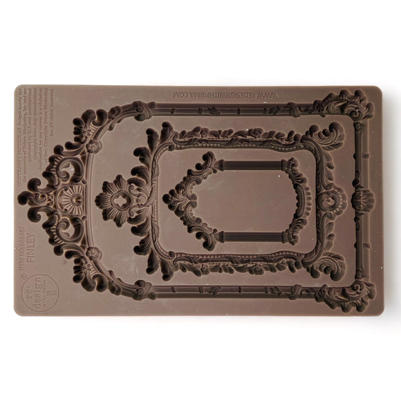 Decorative silicone mold with intricate designs on a white background.