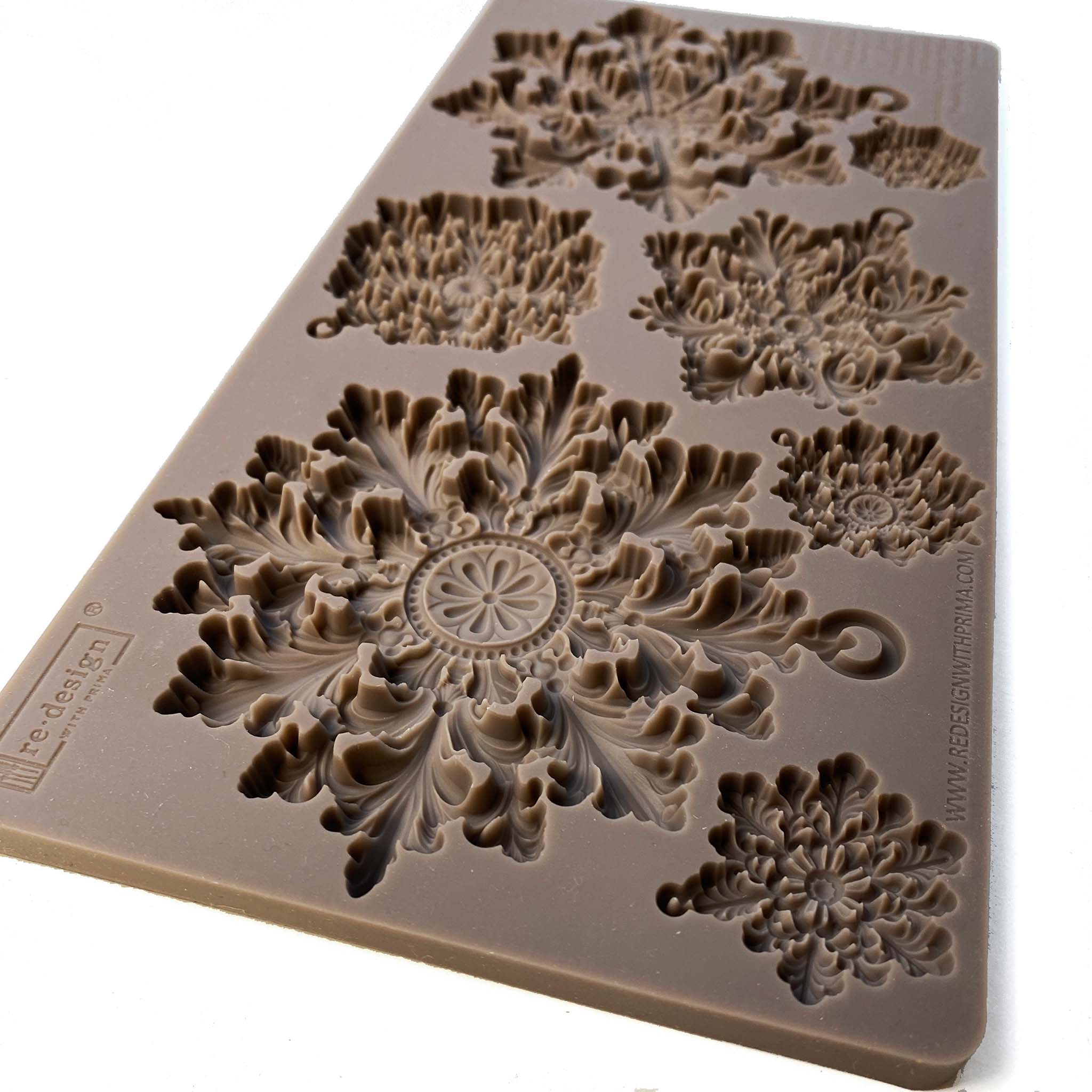An angled view showing the depth of a brown silicone mould of ReDesign with Prima's Frost Spark is against a white background.