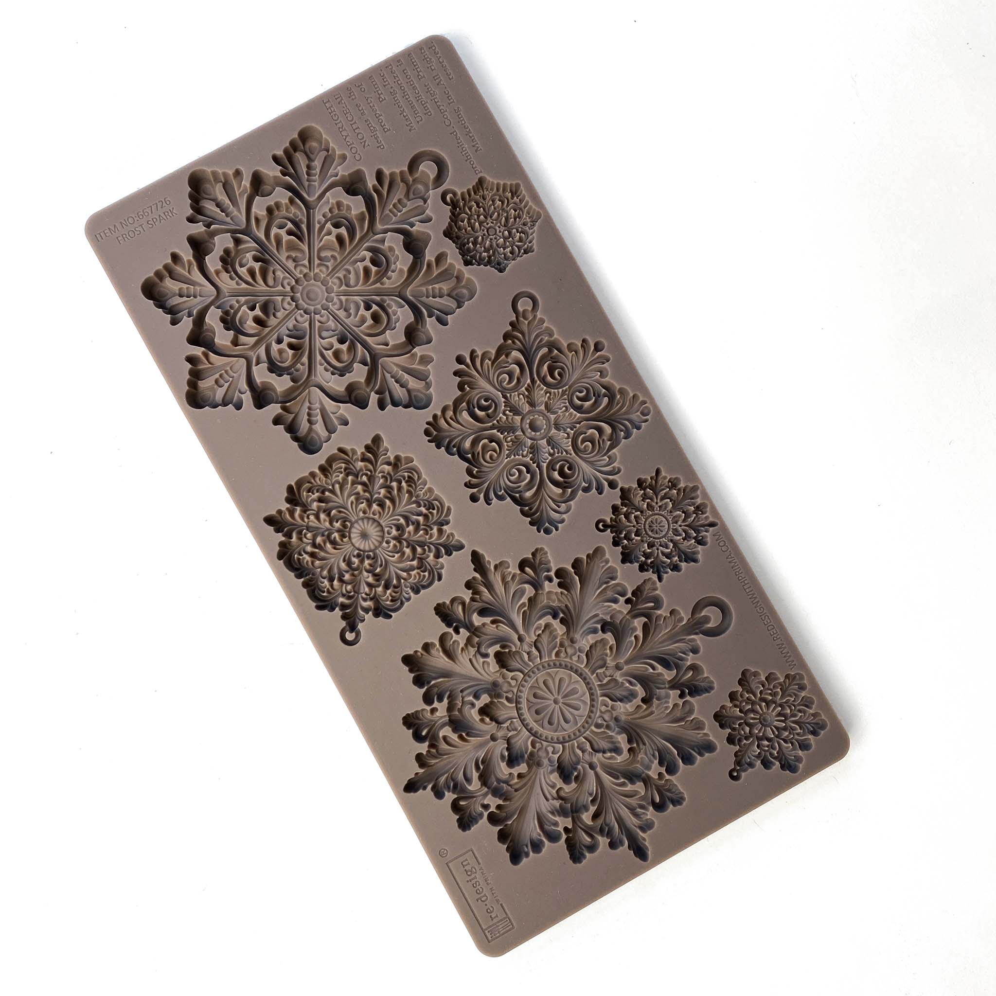 A brown silicone mould of ReDesign with Prima's Frost Spark is against a white background.