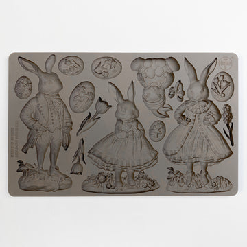 ReDesign with Prima Meadow Whispers Rabbits silicone mold 5x8 showing rabbit characters, bunny with eggs, oval botanical cameos, butterfly, and tulip flowers