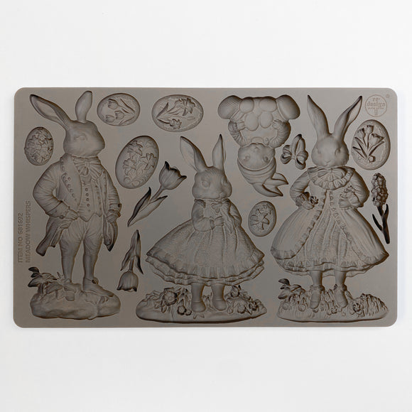 ReDesign with Prima Meadow Whispers Rabbits silicone mold 5x8 showing rabbit characters, bunny with eggs, oval botanical cameos, butterfly, and tulip flowers
