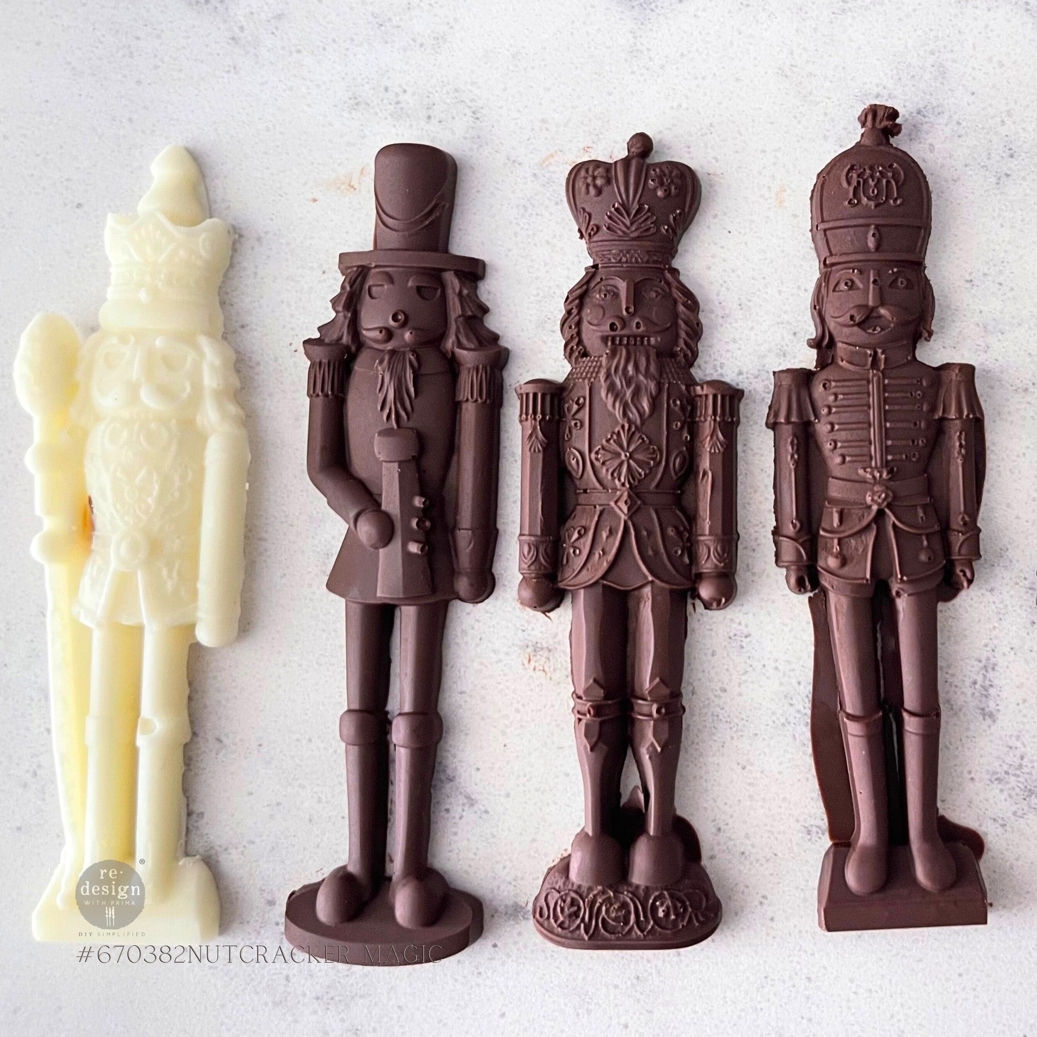 One white chocolate and 3 milk chocolate castings made from ReDesign with Prima's Nutcracker Magic silicone mold are against a white background.