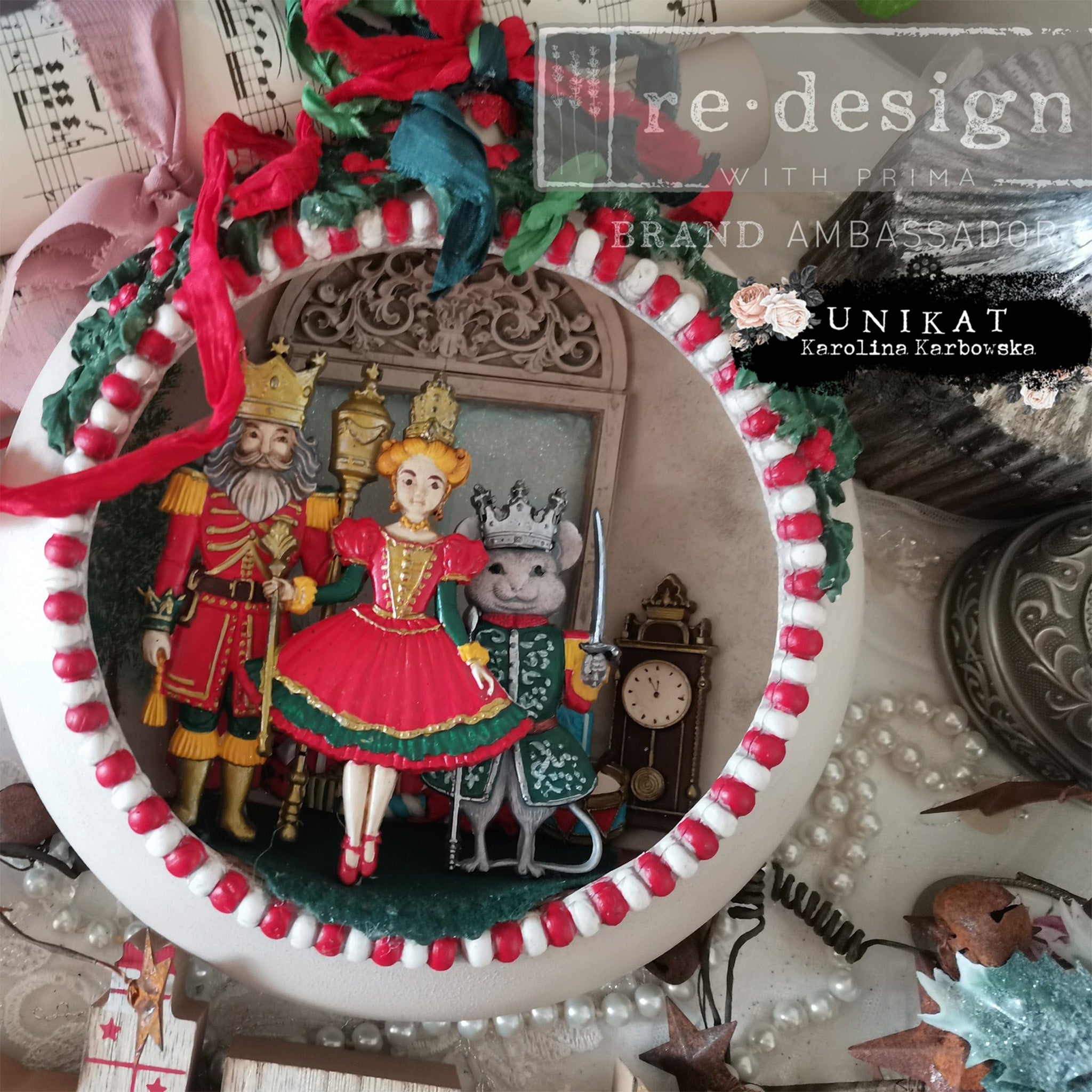 An ornament bulb created by Unikat Karolina Karbowska has the front cut out and features colorful castings of ReDesign with Prima's Nutcracker Party silicone molds inside.