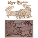 A brown silicone mould and gold/white castings of Santa in his sleigh being pulled by 2 reindeer and the words "Merry Christmas" are against a white background.