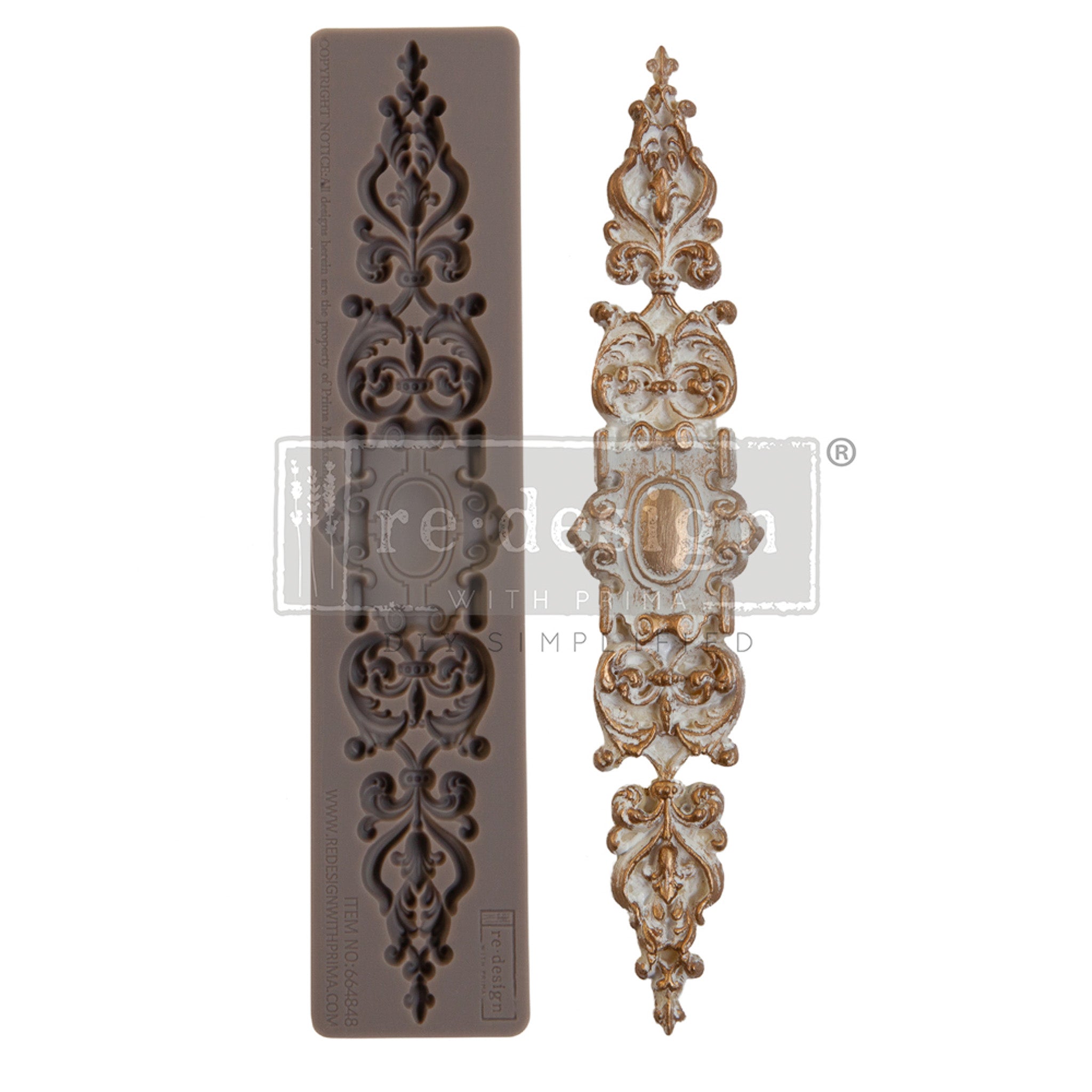 A brown silicone mould and a gold/white colored casting of an ornate accent plate are against a white background.