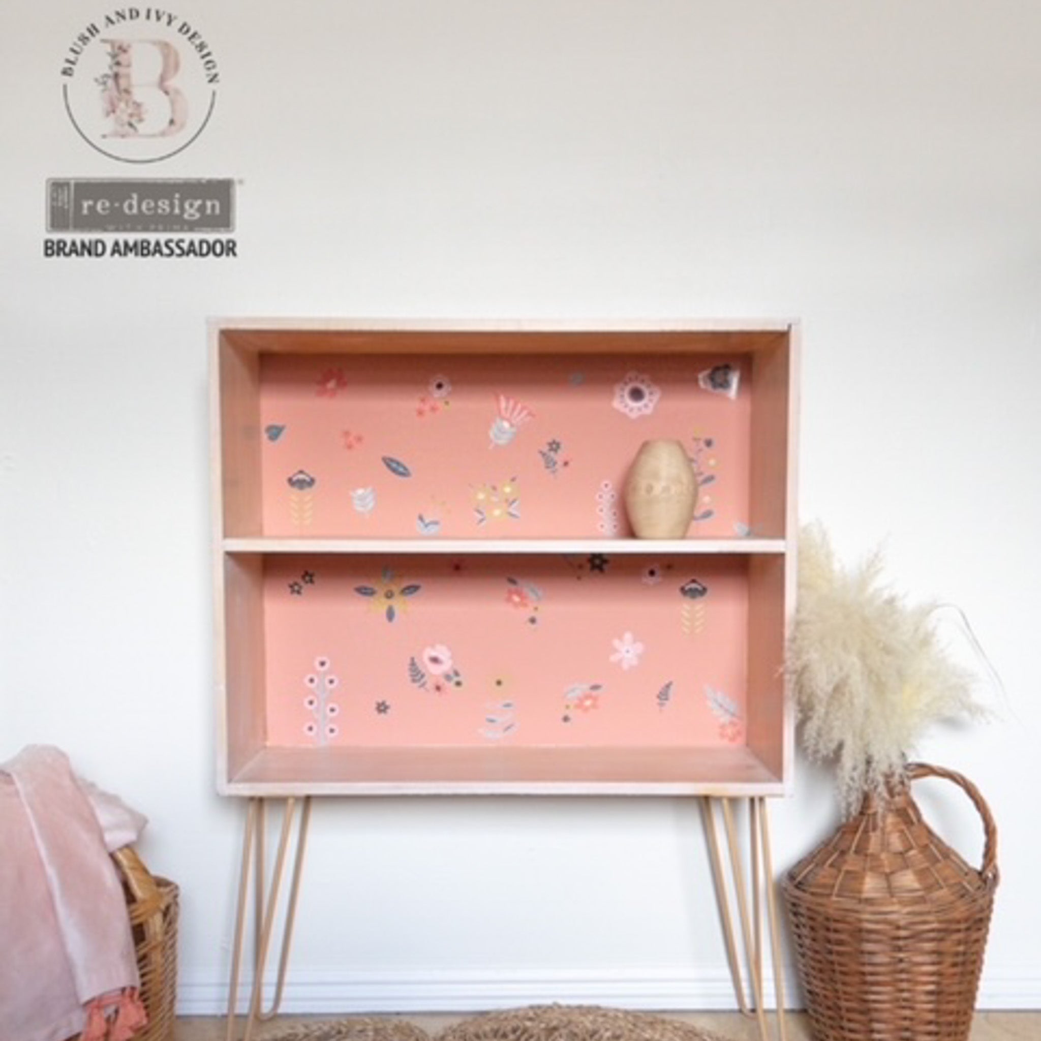 A 2 shelf bookcase refurbished by Blush & Ivy Design is painted light salmon pink inside and features ReDesign with Prima's Doodle Flowers small transfers on the backboard.