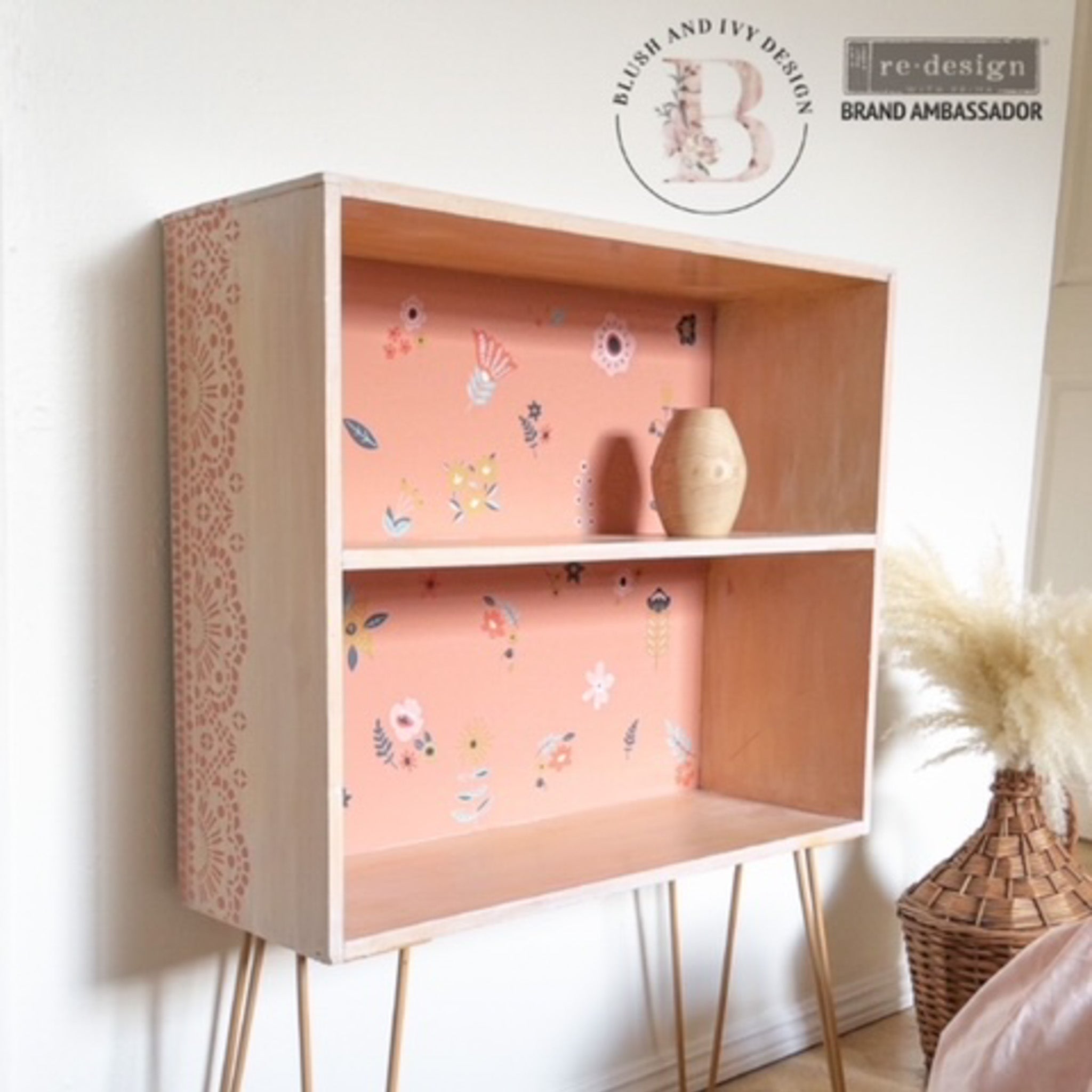 A 2 shelf bookcase refurbished by Blush & Ivy Design is painted white and light salmon pink inside and features ReDesign with Prima's Doodle Flowers small transfers on the backboard.