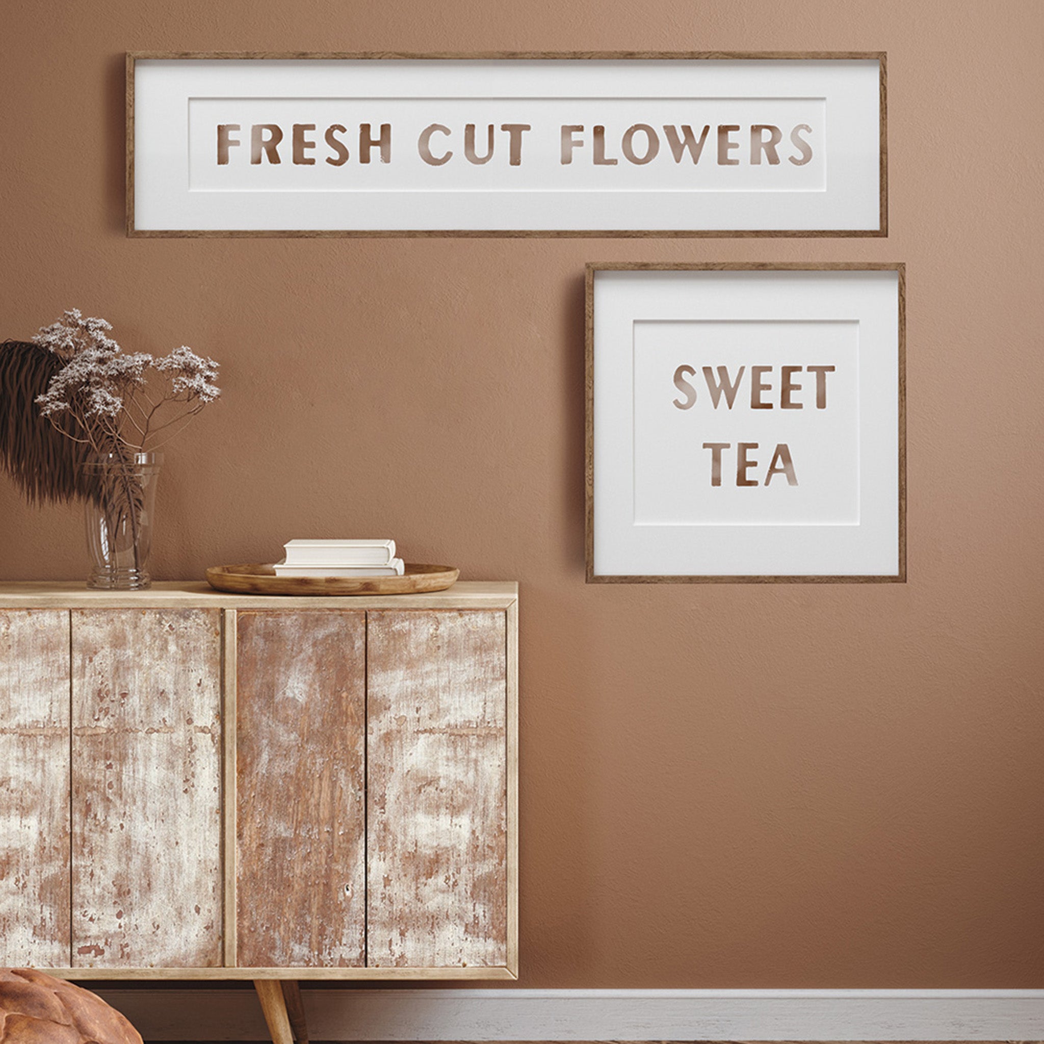 A square and long rectangular wall photo decor feature ReDesign with Prima's Sweet Tea stamps on them. The square photo says "Sweet Tea" and the other says "Fresh Cut Flowers".