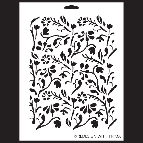 A white stencil against a black background that features a dainty floral design.