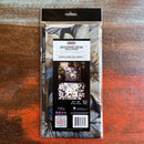 A package of ReDesign with Prima's Cerulean Blooms 1 tissue paper is against a dark wood background.