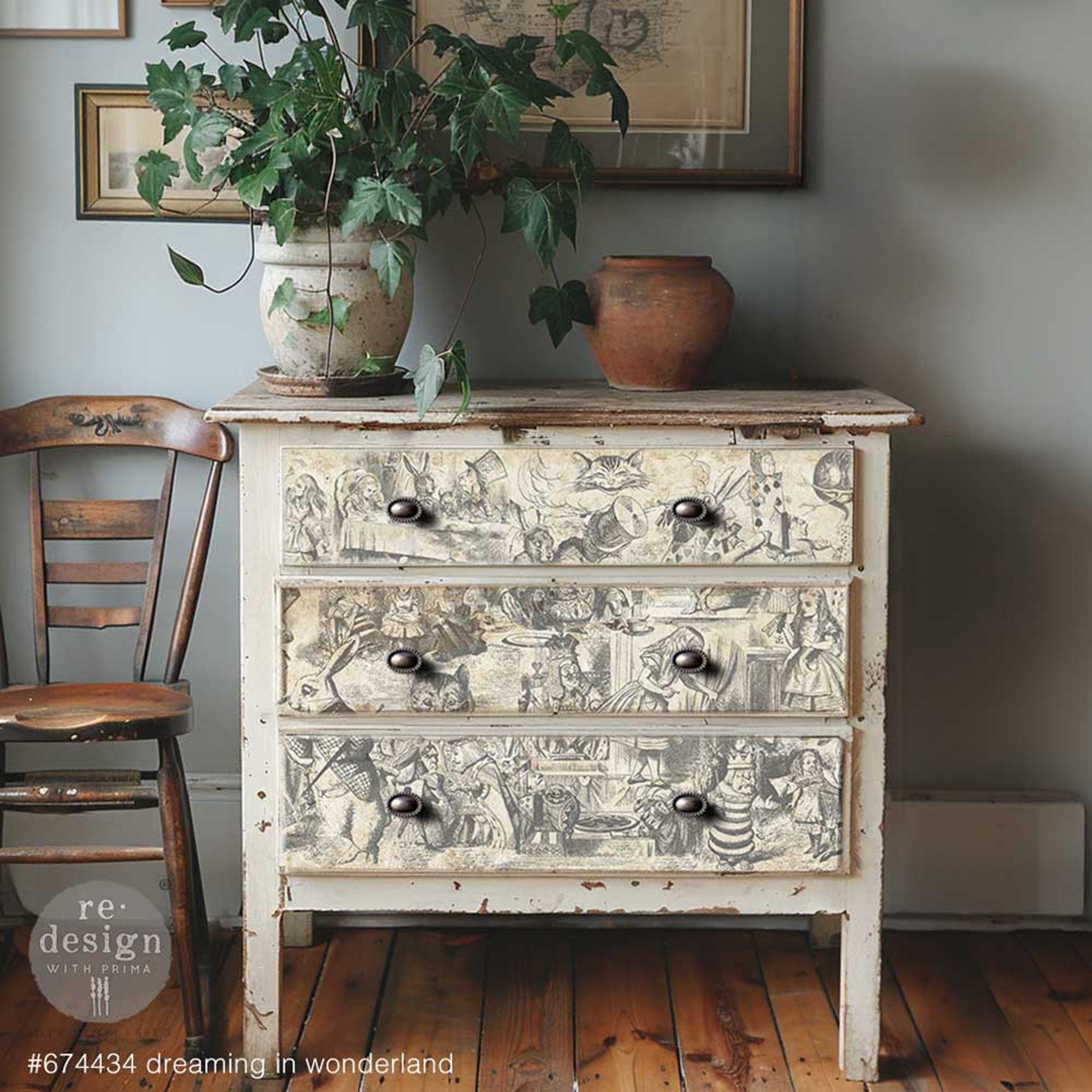 A vintage 3-drawer dresser is painted cream white and features ReDesign with Prima's Dreaming in Wonderland tissue paper on the drawers.