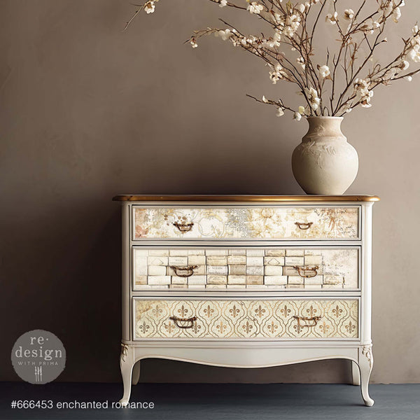 A 3-drawer dresser is painted light beige and features the Enchanted Romance tissue papers on its drawers.